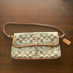 Gently used Coach clutch 16” long x 6” wide